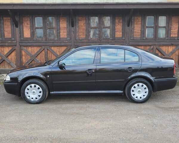 Черный Шкода Октавия, объемом двигателя 1.6 л и пробегом 197 тыс. км за 7150 $, фото 5 на Automoto.ua