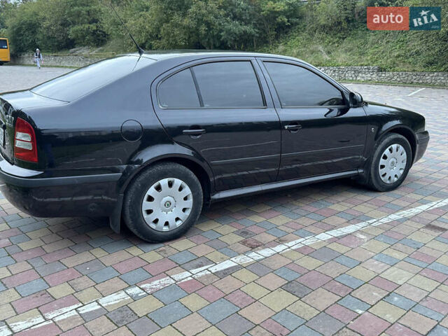 Черный Шкода Октавия, объемом двигателя 1.6 л и пробегом 225 тыс. км за 5650 $, фото 3 на Automoto.ua