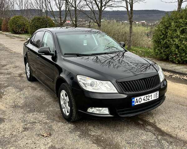 Чорний Шкода Октавія, об'ємом двигуна 1.6 л та пробігом 217 тис. км за 7199 $, фото 1 на Automoto.ua