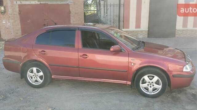 Красный Шкода Октавия, объемом двигателя 2 л и пробегом 317 тыс. км за 4300 $, фото 2 на Automoto.ua