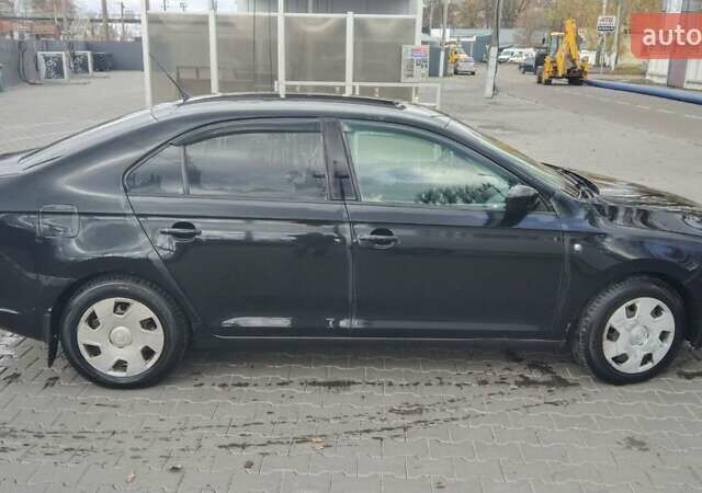 Черный Шкода Рапид, объемом двигателя 1.6 л и пробегом 360 тыс. км за 7500 $, фото 3 на Automoto.ua