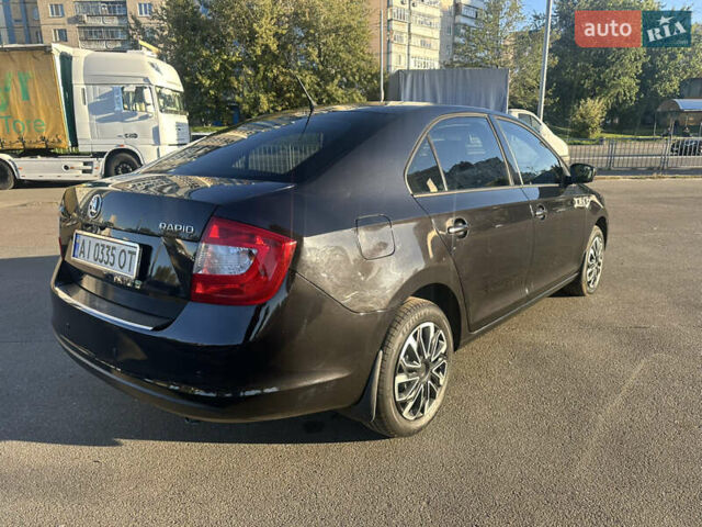 Шкода Рапид 2015 в Киеве на Automoto.ua Черный Шкода Рапид, объемом двигателя 1.2 л и пробегом 231 тыс. км за 7499 $, фото 4 на Automoto.ua