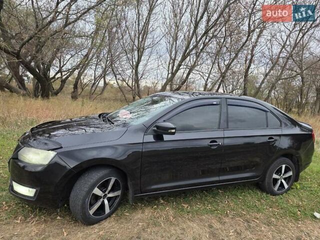 Черный Шкода Рапид, объемом двигателя 1.2 л и пробегом 350 тыс. км за 9000 $, фото 6 на Automoto.ua