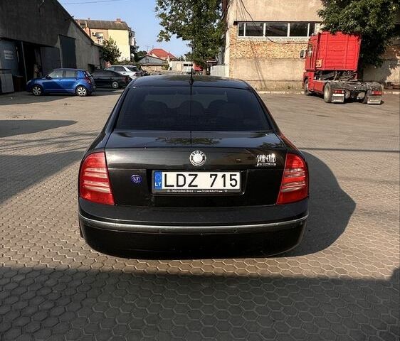 Черный Шкода Суперб, объемом двигателя 2.5 л и пробегом 340 тыс. км за 2039 $, фото 5 на Automoto.ua