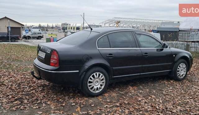 Черный Шкода Суперб, объемом двигателя 1.8 л и пробегом 302 тыс. км за 4500 $, фото 6 на Automoto.ua