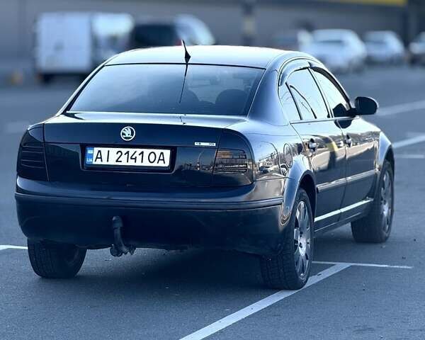 Черный Шкода Суперб, объемом двигателя 1.9 л и пробегом 335 тыс. км за 6000 $, фото 1 на Automoto.ua