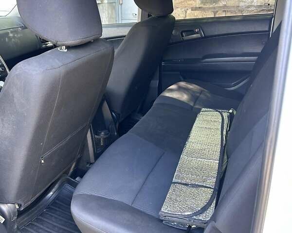 Білий Cанг Йонг Actyon, об'ємом двигуна 2 л та пробігом 180 тис. км за 14000 $, фото 11 на Automoto.ua
