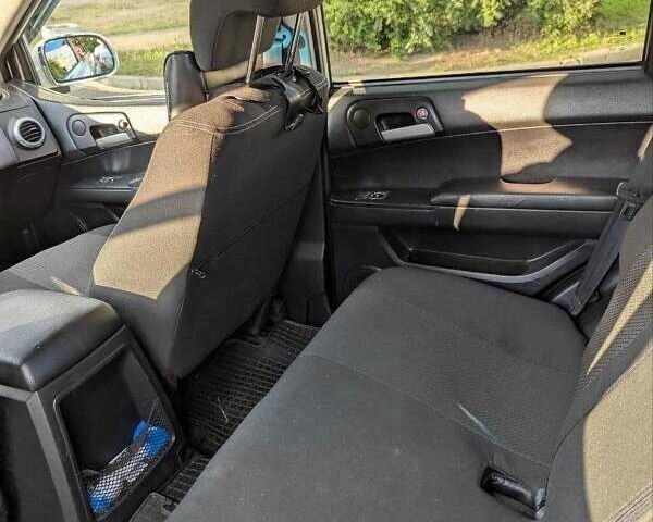 Белый Cанг Йонг Актион, объемом двигателя 2.3 л и пробегом 85 тыс. км за 8000 $, фото 5 на Automoto.ua