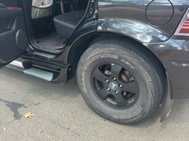 Черный Cанг Йонг Актион, объемом двигателя 2 л и пробегом 266 тыс. км за 7500 $, фото 4 на Automoto.ua