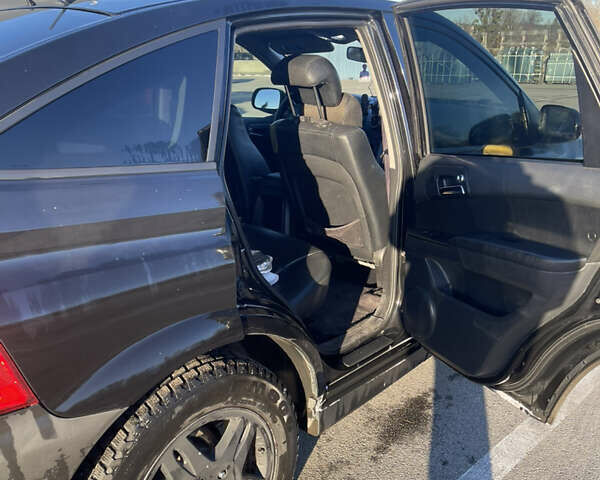 Черный Cанг Йонг Актион, объемом двигателя 2.3 л и пробегом 223 тыс. км за 5500 $, фото 8 на Automoto.ua