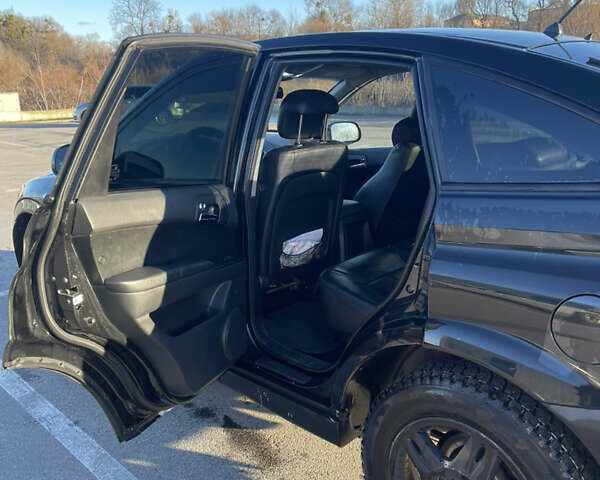 Черный Cанг Йонг Актион, объемом двигателя 2.3 л и пробегом 223 тыс. км за 5500 $, фото 7 на Automoto.ua