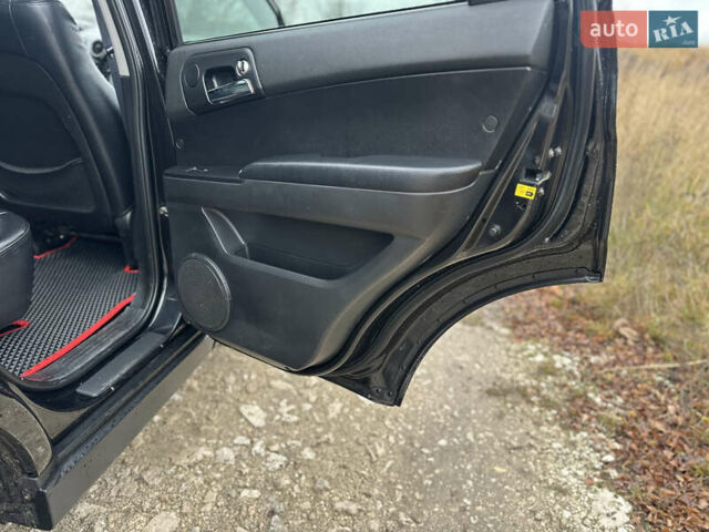 Чорний Cанг Йонг Actyon, об'ємом двигуна 2 л та пробігом 110 тис. км за 6900 $, фото 35 на Automoto.ua