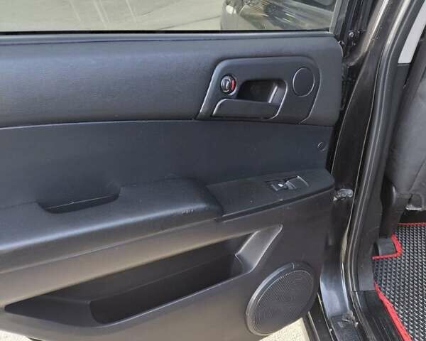 Чорний Cанг Йонг Actyon, об'ємом двигуна 2 л та пробігом 221 тис. км за 5800 $, фото 14 на Automoto.ua