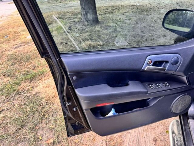 Черный Cанг Йонг Актион, объемом двигателя 2 л и пробегом 240 тыс. км за 8200 $, фото 4 на Automoto.ua