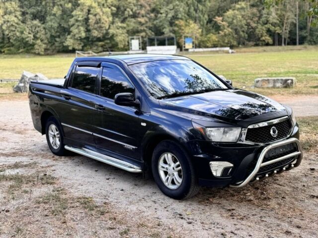 Черный Cанг Йонг Актион, объемом двигателя 2 л и пробегом 240 тыс. км за 8200 $, фото 1 на Automoto.ua