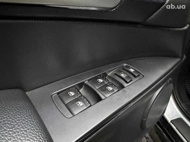 Сірий Cанг Йонг KYRON DELUXE, об'ємом двигуна 2 л та пробігом 220 тис. км за 8390 $, фото 11 на Automoto.ua