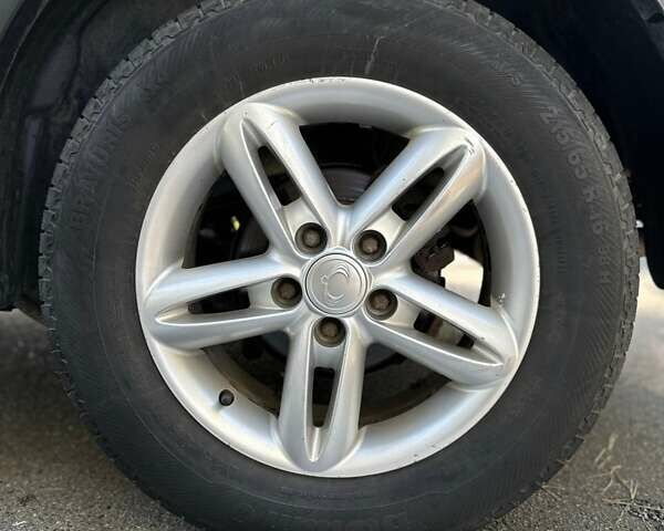 Белый Cанг Йонг Корандо, объемом двигателя 2 л и пробегом 111 тыс. км за 9300 $, фото 6 на Automoto.ua