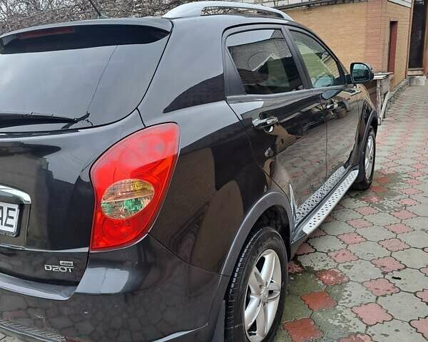 Черный Cанг Йонг Корандо, объемом двигателя 2 л и пробегом 138 тыс. км за 8800 $, фото 2 на Automoto.ua