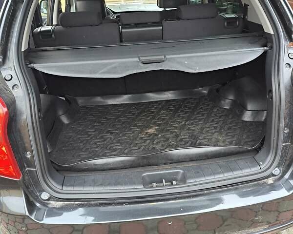 Черный Cанг Йонг Корандо, объемом двигателя 2 л и пробегом 138 тыс. км за 8800 $, фото 6 на Automoto.ua