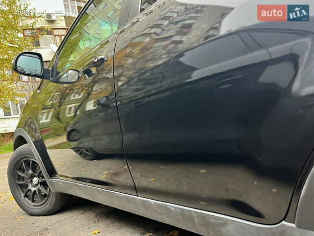 Черный Cанг Йонг Корандо, объемом двигателя 2 л и пробегом 168 тыс. км за 7200 $, фото 14 на Automoto.ua