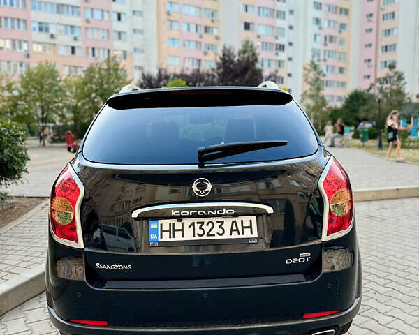 Черный Cанг Йонг Корандо, объемом двигателя 2 л и пробегом 265 тыс. км за 7700 $, фото 2 на Automoto.ua