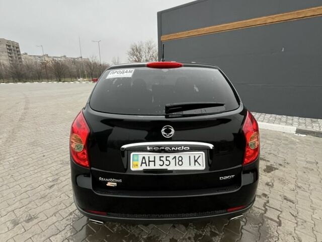 Черный Cанг Йонг Корандо, объемом двигателя 2 л и пробегом 55 тыс. км за 11650 $, фото 3 на Automoto.ua