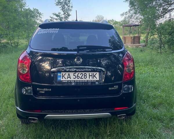 Черный Cанг Йонг Корандо, объемом двигателя 2 л и пробегом 120 тыс. км за 9900 $, фото 8 на Automoto.ua