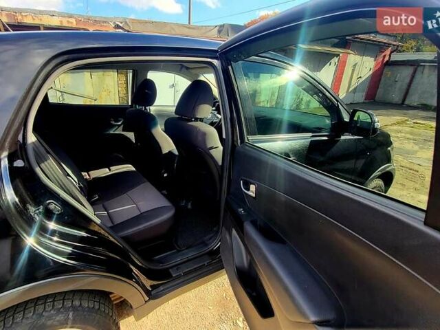 Черный Cанг Йонг Корандо, объемом двигателя 2 л и пробегом 100 тыс. км за 8300 $, фото 12 на Automoto.ua