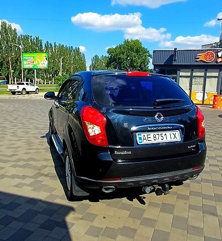 Черный Cанг Йонг Корандо, объемом двигателя 2 л и пробегом 100 тыс. км за 11700 $, фото 2 на Automoto.ua