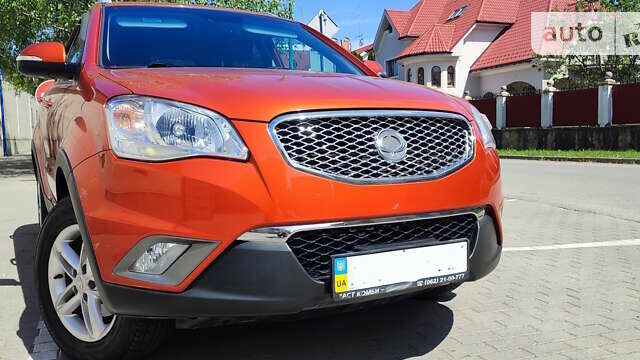 Помаранчевий Cанг Йонг Korando, об'ємом двигуна 2 л та пробігом 124 тис. км за 10990 $, фото 14 на Automoto.ua