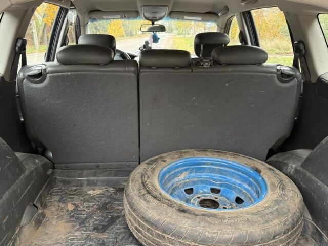 Черный Cанг Йонг Кирон, объемом двигателя 2 л и пробегом 155 тыс. км за 3500 $, фото 7 на Automoto.ua