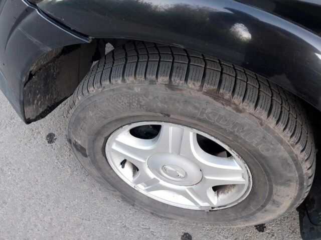 Чорний Cанг Йонг Kyron, об'ємом двигуна 2 л та пробігом 200 тис. км за 4500 $, фото 8 на Automoto.ua