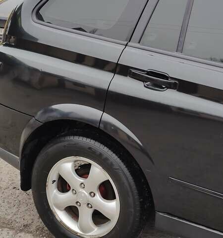 Чорний Cанг Йонг Kyron, об'ємом двигуна 2 л та пробігом 174 тис. км за 7000 $, фото 3 на Automoto.ua