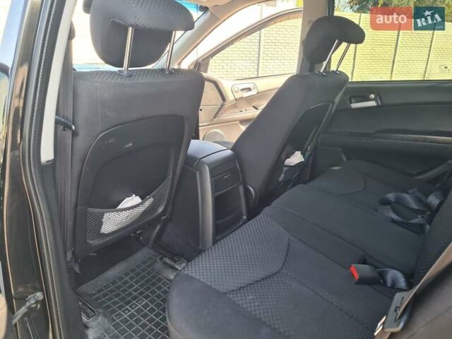 Чорний Cанг Йонг Kyron, об'ємом двигуна 2 л та пробігом 133 тис. км за 10000 $, фото 21 на Automoto.ua