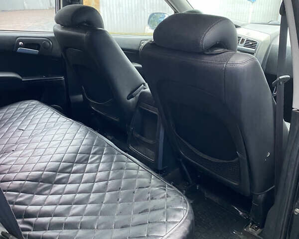 Чорний Cанг Йонг Kyron, об'ємом двигуна 2 л та пробігом 220 тис. км за 5000 $, фото 32 на Automoto.ua