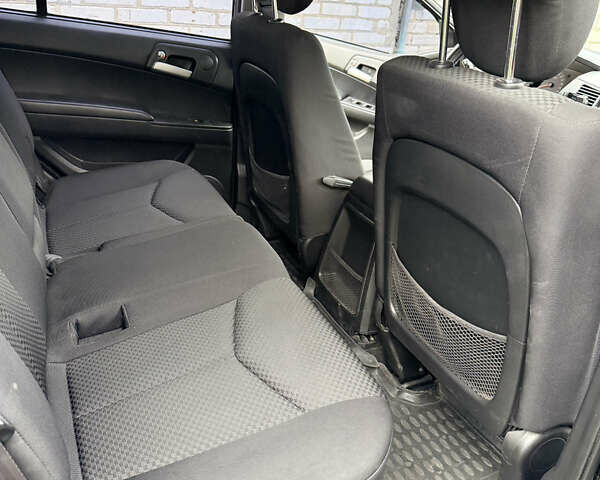 Чорний Cанг Йонг Kyron, об'ємом двигуна 2.3 л та пробігом 113 тис. км за 7500 $, фото 21 на Automoto.ua