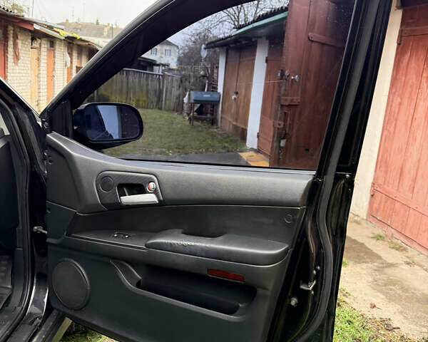 Чорний Cанг Йонг Kyron, об'ємом двигуна 2.3 л та пробігом 113 тис. км за 7500 $, фото 19 на Automoto.ua