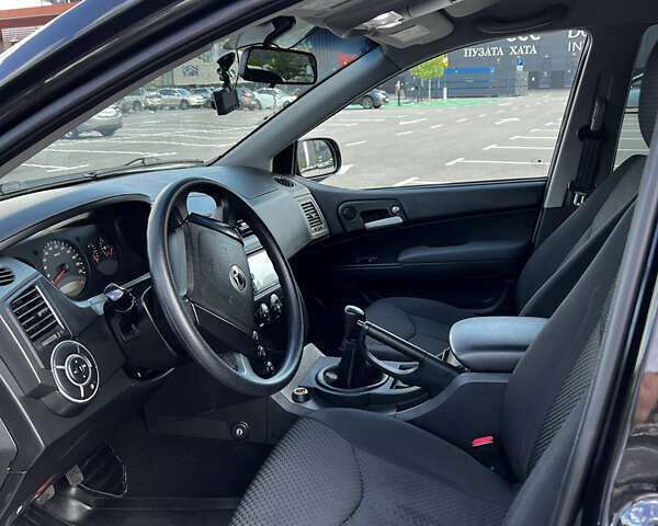 Чорний Cанг Йонг Kyron, об'ємом двигуна 2 л та пробігом 107 тис. км за 6800 $, фото 8 на Automoto.ua