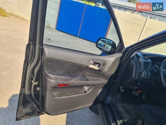 Чорний Cанг Йонг Kyron, об'ємом двигуна 2 л та пробігом 133 тис. км за 10000 $, фото 16 на Automoto.ua