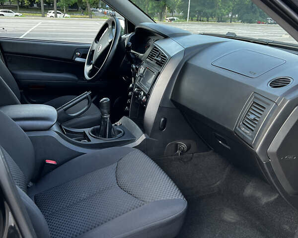 Чорний Cанг Йонг Kyron, об'ємом двигуна 2 л та пробігом 107 тис. км за 6800 $, фото 15 на Automoto.ua