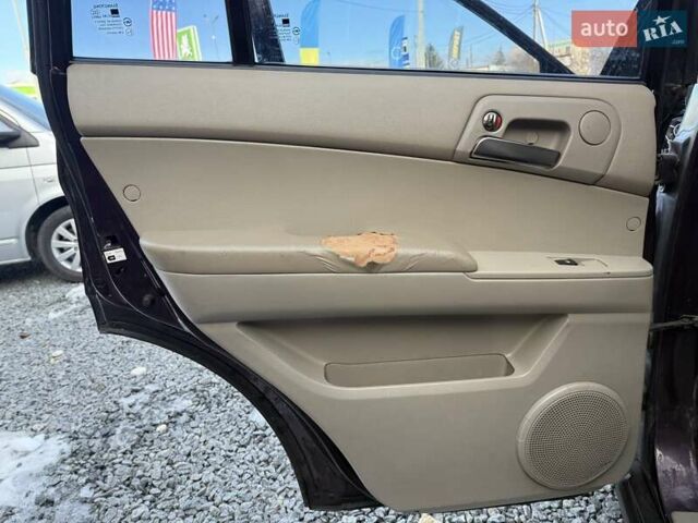 Фіолетовий Cанг Йонг Kyron, об'ємом двигуна 2 л та пробігом 337 тис. км за 5350 $, фото 13 на Automoto.ua