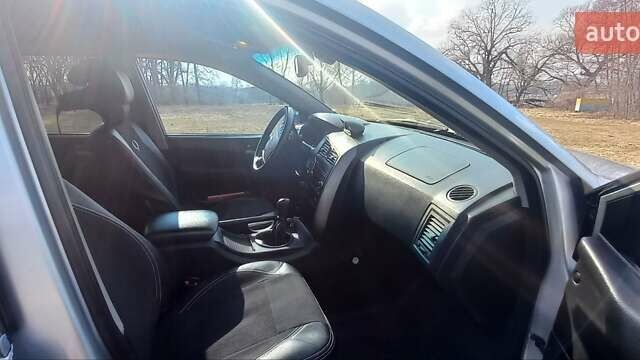Сірий Cанг Йонг Kyron, об'ємом двигуна 2 л та пробігом 250 тис. км за 8500 $, фото 23 на Automoto.ua