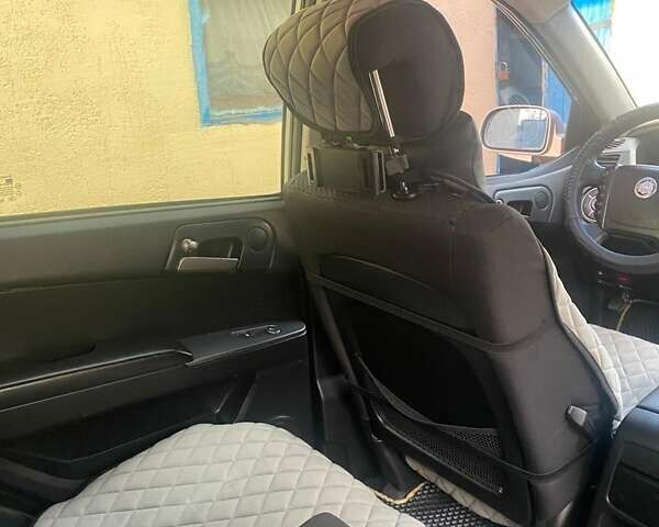 Сірий Cанг Йонг Kyron, об'ємом двигуна 2 л та пробігом 241 тис. км за 7550 $, фото 18 на Automoto.ua