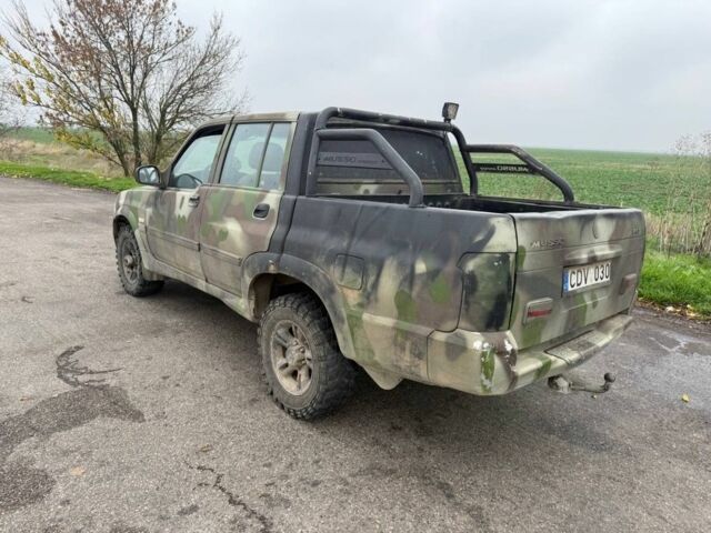 Бежевый Cанг Йонг Муссо, объемом двигателя 2.9 л и пробегом 200 тыс. км за 2200 $, фото 2 на Automoto.ua