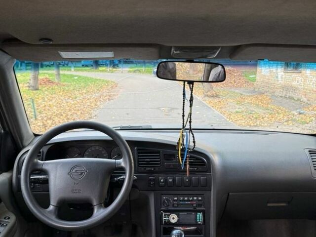 Серый Cанг Йонг Муссо, объемом двигателя 3 л и пробегом 300 тыс. км за 2350 $, фото 4 на Automoto.ua