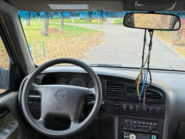 Серый Cанг Йонг Муссо, объемом двигателя 3 л и пробегом 300 тыс. км за 2350 $, фото 5 на Automoto.ua