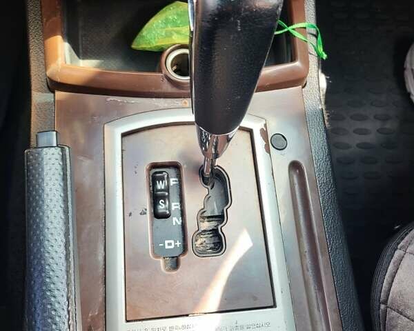 Чорний Cанг Йонг Rexton, об'ємом двигуна 2.7 л та пробігом 118 тис. км за 6000 $, фото 13 на Automoto.ua