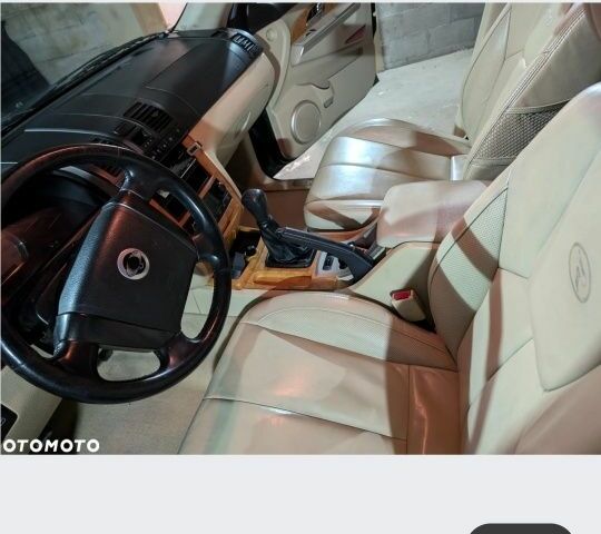 Черный Cанг Йонг Рекстон, объемом двигателя 2.7 л и пробегом 300 тыс. км за 4500 $, фото 5 на Automoto.ua