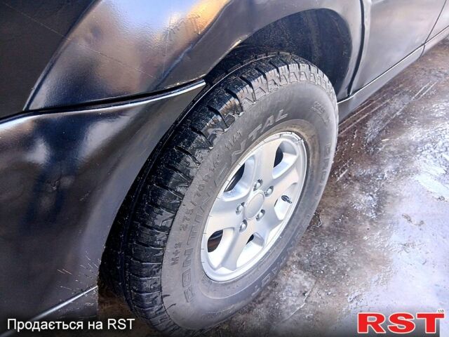 Черный Cанг Йонг Рекстон, объемом двигателя 2.7 л и пробегом 327 тыс. км за 3300 $, фото 12 на Automoto.ua