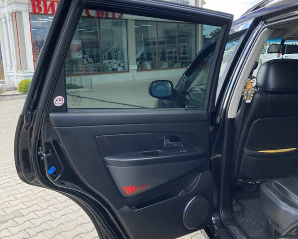 Чорний Cанг Йонг Rexton, об'ємом двигуна 2.7 л та пробігом 159 тис. км за 8499 $, фото 10 на Automoto.ua